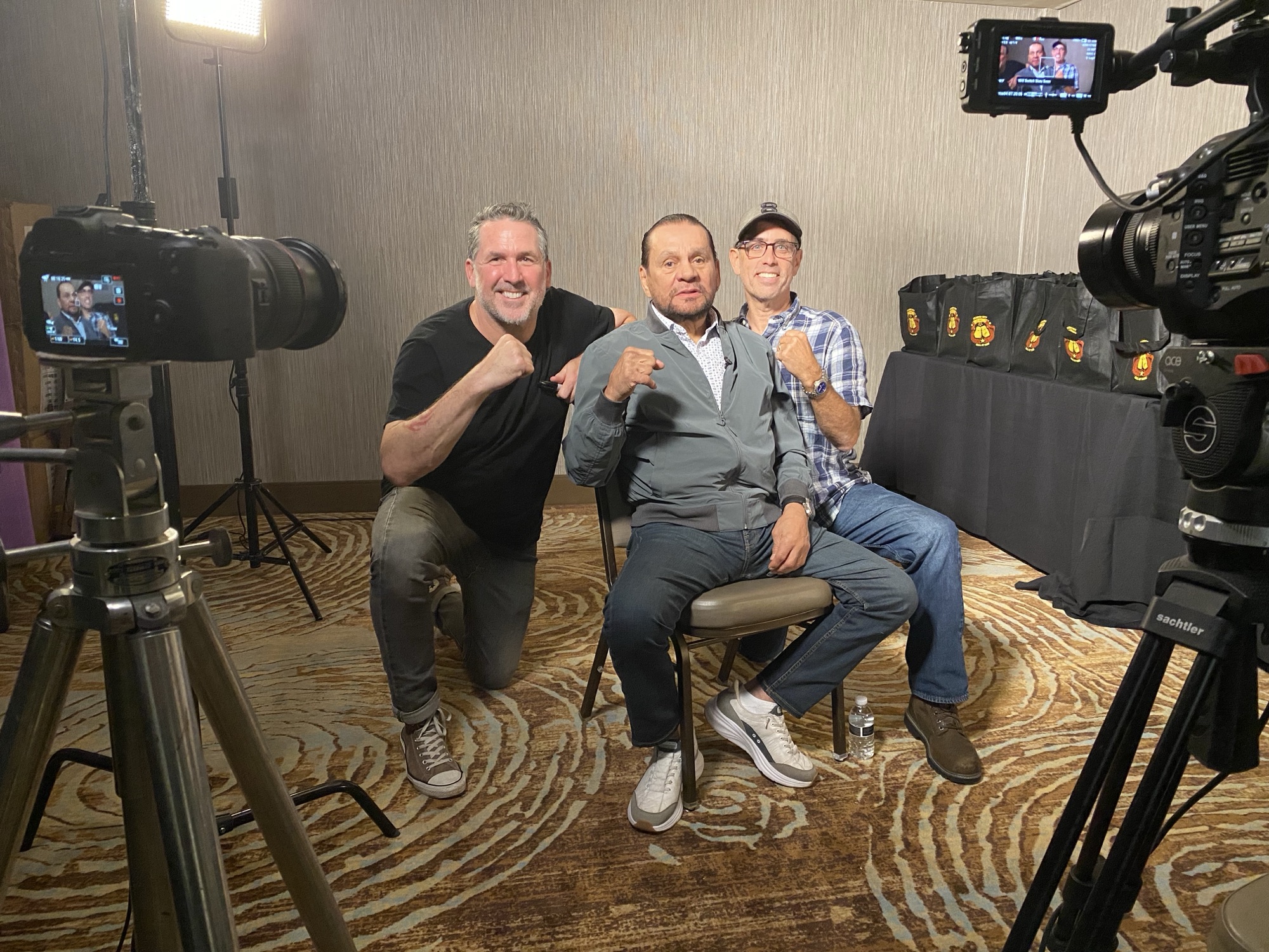 Evan Haiman and crew with a boxer between takes