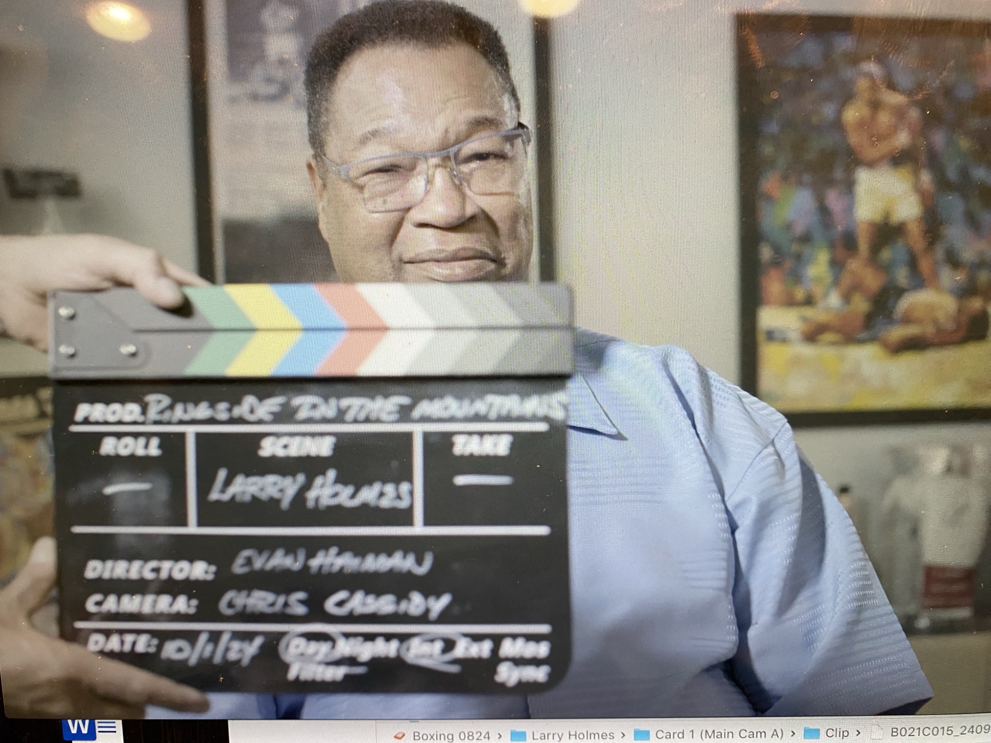 Larry Holmes holding the slate for his interview